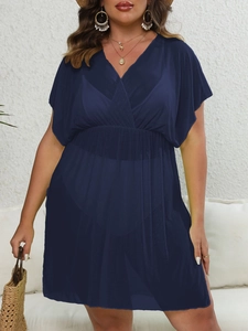 Detail of navy blue plus size mesh beach cover-up with deep V-neck and ruched waist
