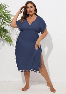 Detail of dark blue plus size beach cover-up featuring fringe trim and high waist