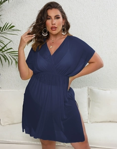 Detail of navy blue mesh beach cover-up featuring a deep V-neck and high waistline