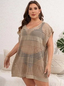 Detailed macro shot of khaki crochet hollow-out pattern on this plus size beach dress