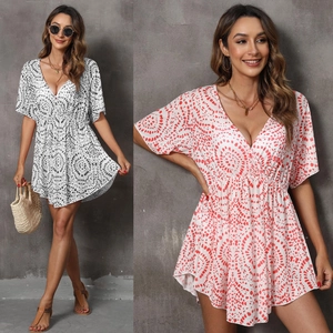 Detail of V-neck printed beach cover-up with elastic waist and boho geometric pattern