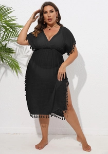 Detail of plus size black V-neck beach cover-up dress with decorative fringe hem