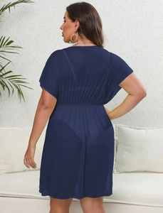 Back view of a sheer navy blue mesh beach cover-up dress with an elastic waist