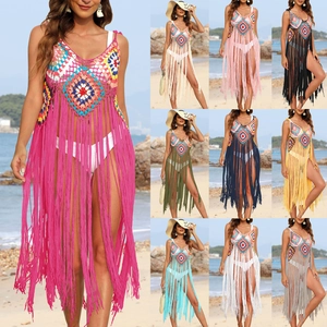 Detail of colorful crochet beach cover-up with long tassels and deep V-neck in ten colors