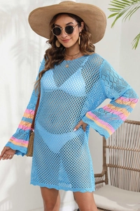 Detail of crochet beach cover-up with vibrant colorful striped flared sleeves for summer