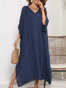 Detail of dark blue V-neck beach cover-up dress with side slits and loose batwing sleeves