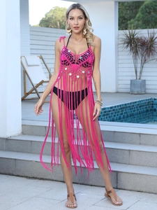 Rose red crochet bikini cover-up with sequin detailing and long fringe on poolside model