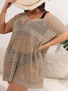 Detail of khaki crochet knit beach cover-up showing intricate hollow-out mesh texture