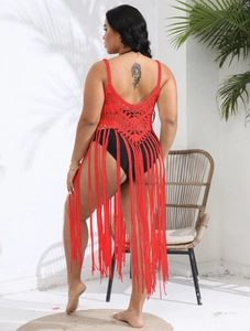 Detailed back view of a red crochet beach cover-up with long tassels and openwork patterns