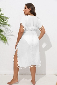 Detailed back view of white beach cover-up with fringe trim and waist tie design