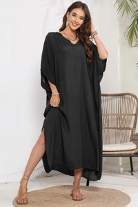 Detailed texture of black cotton linen beach cover-up dress with V-neck and side split