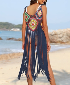 Detailed back view of crochet beach cover-up with colorful diamond patterns and long tassels