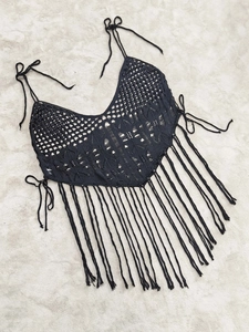 Plus size black crochet halter top with boho tassels and geometric openwork texture
