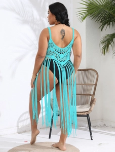 Close-up of sky blue crochet bikini cover-up with intricate hollow patterns and long tassels