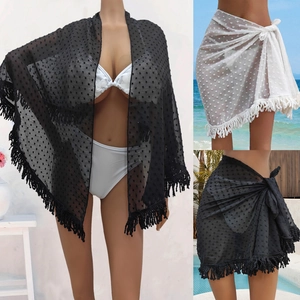 Sheer polka dot sarong with tassel trim showing versatile beach wrap and shawl styles