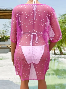 Robe de plage en tulle rose fuchsia à étoiles argentées avec vue de dos au bord