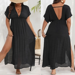 Detail view of black summer maxi dress with deep V-neck, backless design and high side slit