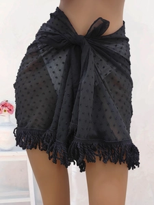 Black swiss dot sarong with tassel trim and tie waist for beach swimwear cover-up