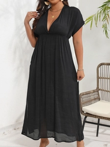 Detail view of the textured black fabric on this deep V-neck high waist maxi dress