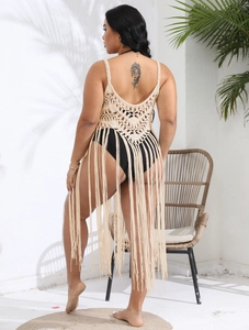 Detail view of beige crochet beach cover-up with open back and boho fringe hem