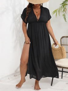 Detail of elegant black deep V-neck maxi beach dress with side slit for summer vacation