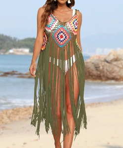 Detail of bohemian handmade crochet beach cover-up with colorful floral patterns and long tassels
