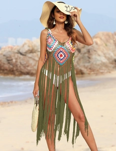 Detail of crochet boho beach cover-up with colorful geometric patterns and long fringes