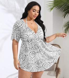 Detail of plus size white cover-up dress with deep V-neck and black swirl patterns