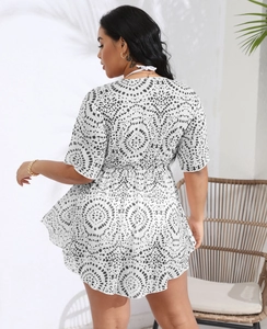 Detail of plus size white deep V-neck beach cover-up dress with black geometric dot print