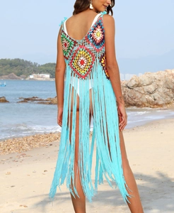 Detail of multi-color crochet pattern and long sky blue fringe on a beach dress