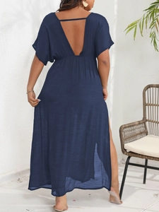 Detail of the deep V-back design and lace-up closure on this navy blue maxi dress