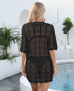 Detail of black crochet cover-up showing geometric hollow patterns and poolside back view