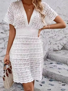 White deep V-neck hollow out beach dress with elastic waist and geometric crochet pattern
