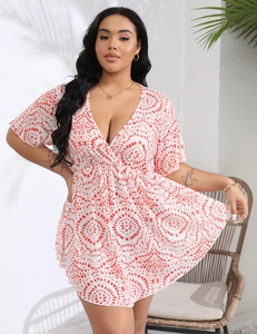 Close-up of bohemian deep V-neck dress with red mandala print and elastic high waist
