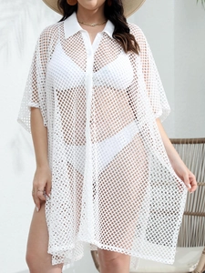 Detail of white mesh beach cover-up featuring button-down front and classic collar