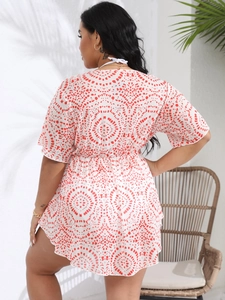 Detail of plus size summer dress featuring red floral print and elastic waist tie-back