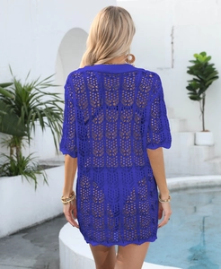 Detailed back view of a royal blue crochet beach cover-up with hollow knit patterns