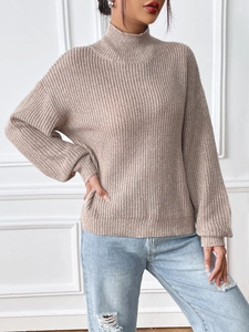 Women's mock neck chunky knit sweater in oatmeal beige with a loose fit and ribbed cuffs