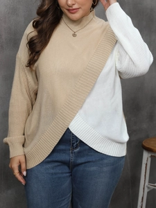 Detail of cross-knit texture on a two-tone oversized turtleneck sweater for women