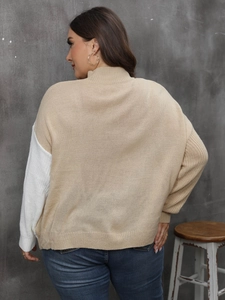Detail of color-block knit sweater with mock neck and soft textured stitching