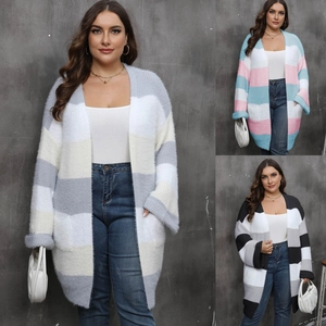 Close-up of oversized striped cardigan featuring fuzzy texture and large patch pockets