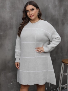 Women's plus size light grey knit sweater dress with striped pattern and crew neck
