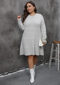 Detailed knit texture of a grey long sleeve dress with white plaid stripe pattern