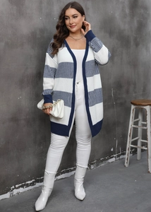 Detail of V-neck striped cardigan showing navy and white knit texture and ribbed cuffs