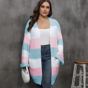 Close-up of fluffy mohair striped cardigan texture with blue white and pink knit patterns