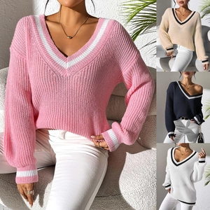 Detailed knit texture and color contrast V-neck stripes on a loose casual sweater