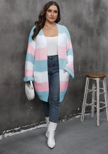 Close-up of soft knit cardigan featuring pastel color block stripes and deep side pockets