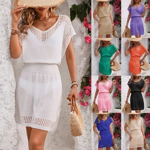 Detail of V-neck knit beach cover-up showing breathable openwork patterns and various colors