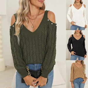 Detail of V-neck cold shoulder knit sweater with cable texture and pearl strap accents