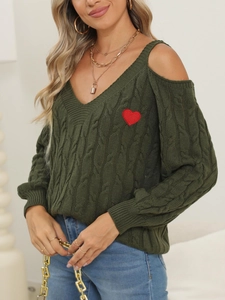 Detail of army green cable knit sweater with off-shoulder design and red heart patch
